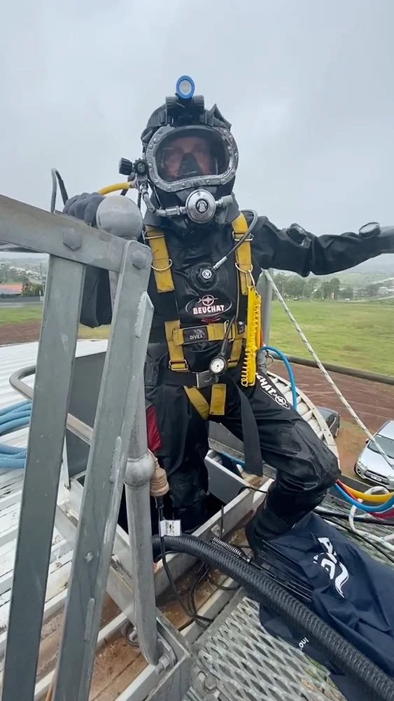 Fire Tanks Australia contamination diver in full protective gear preparing for a fire tank inspection.