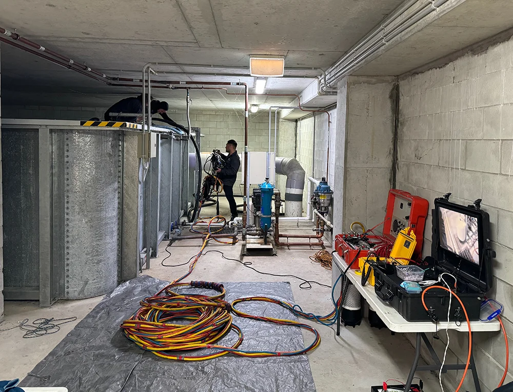Fire Tanks Australia team conducting an underground fire tank inspection using advanced monitoring and safety equipment.